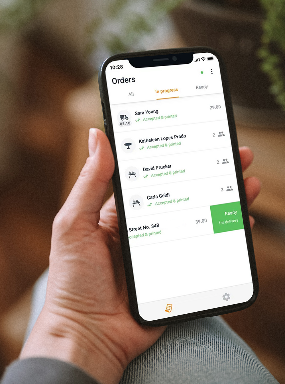 View of the online food booking app on an order receiving smartphone & tablet